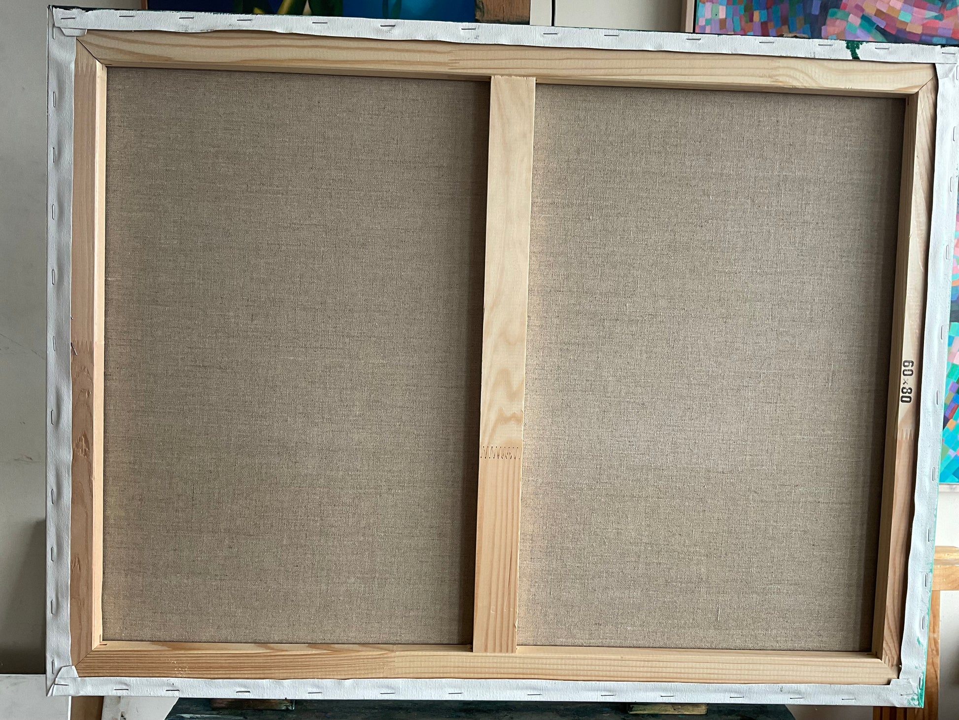 Achterkant van een schilderij van Corné Akkers met naam The Infinite Waves of Eternity